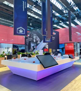 Messestand von WOLF mit dem beleuchteten Ecosystem, hängenden Bannern sowie modern gestalteten Informationsflächen